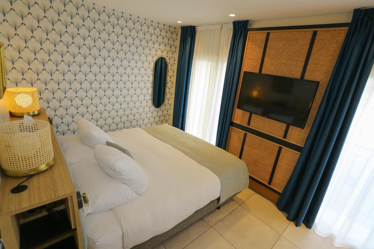 Un ou plusieurs lits dans un hébergement de l'établissement Splendid Hôtel & Spa