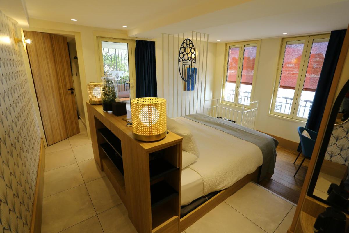 Un ou plusieurs lits dans un hébergement de l'établissement Splendid Hôtel & Spa