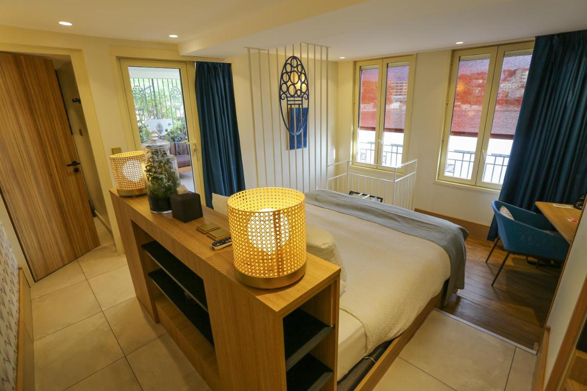 Un ou plusieurs lits dans un hébergement de l'établissement Splendid Hôtel & Spa