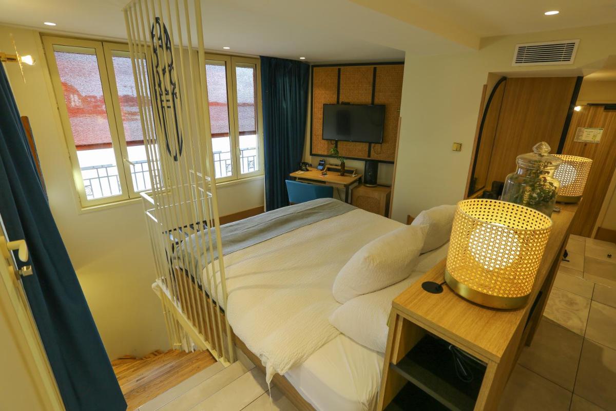 Un ou plusieurs lits dans un hébergement de l'établissement Splendid Hôtel & Spa