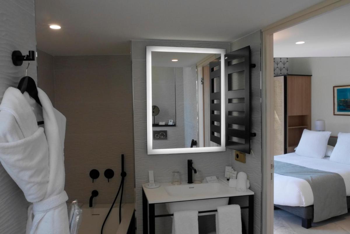 Un ou plusieurs lits dans un hébergement de l'établissement Splendid Hôtel & Spa