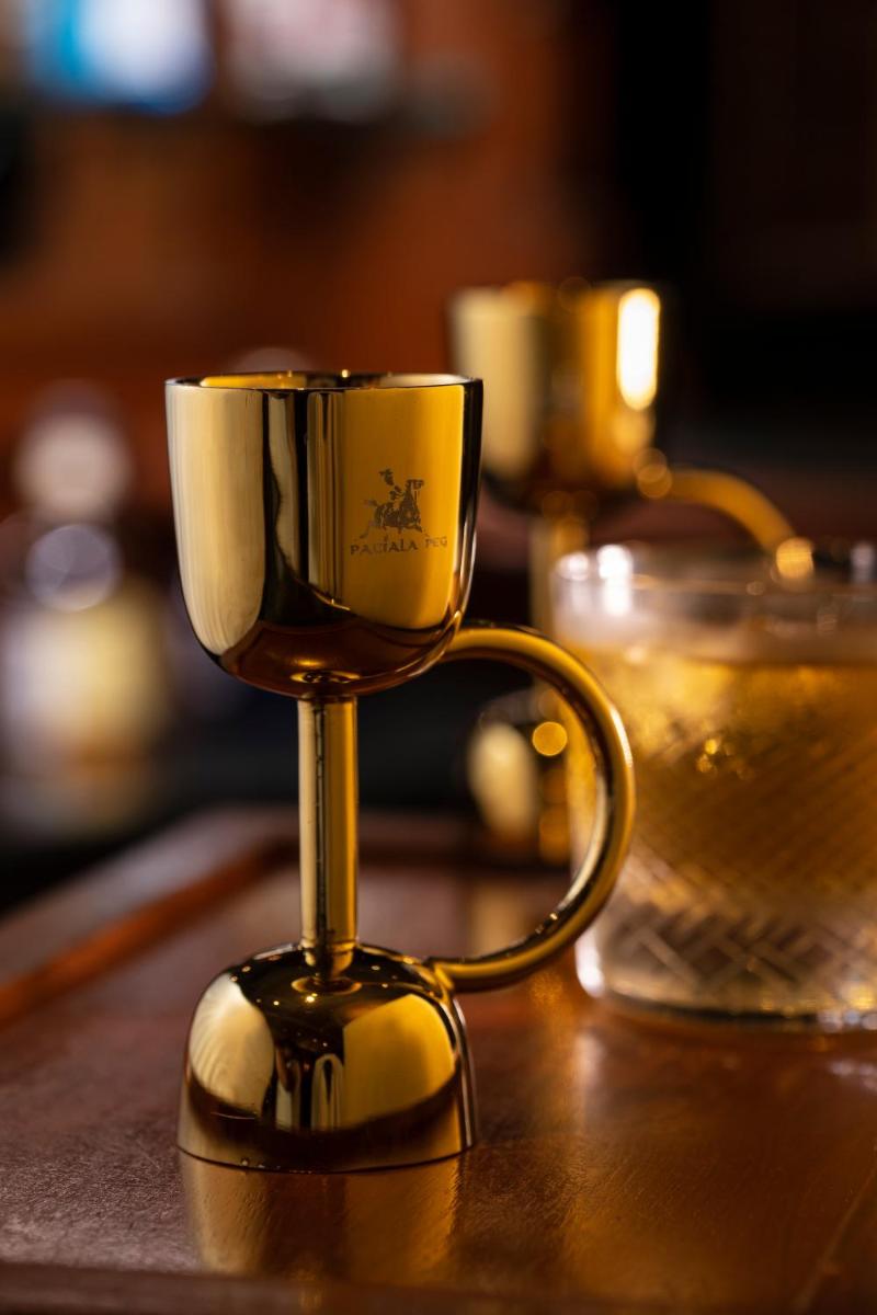 a coffee cup sitting on top of a table at The Imperial, New Delhi in New Delhi a coffee cup sitting on top of a table at The Imperial, New Delhi in New Delhi