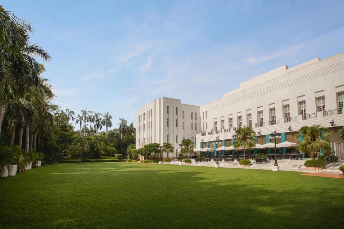 a large field of grass in front of a building at The Imperial, New Delhi in New Delhi a large field of grass in front of a building at The Imperial, New Delhi in New Delhi