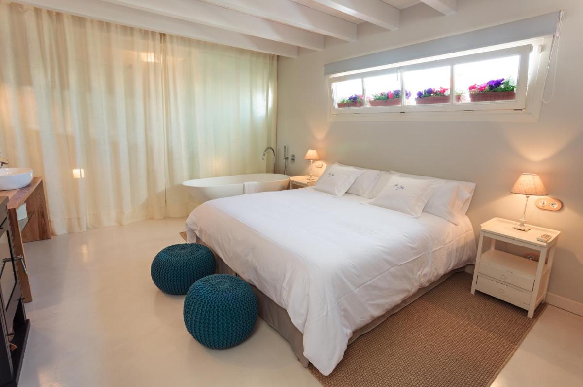 Cama o camas de una habitación en Jardí de Ses Bruixes Boutique Hotel