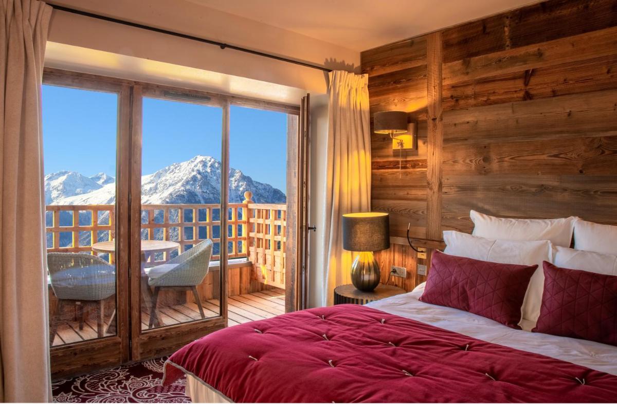 Un ou plusieurs lits dans un hébergement de l'établissement Hotel Le V de Vaujany