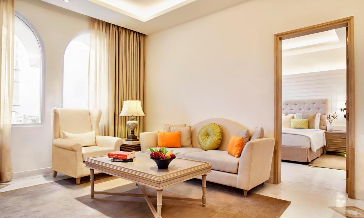 a living room with a couch and a table at Taj Ganges Varanasi in Varanasi