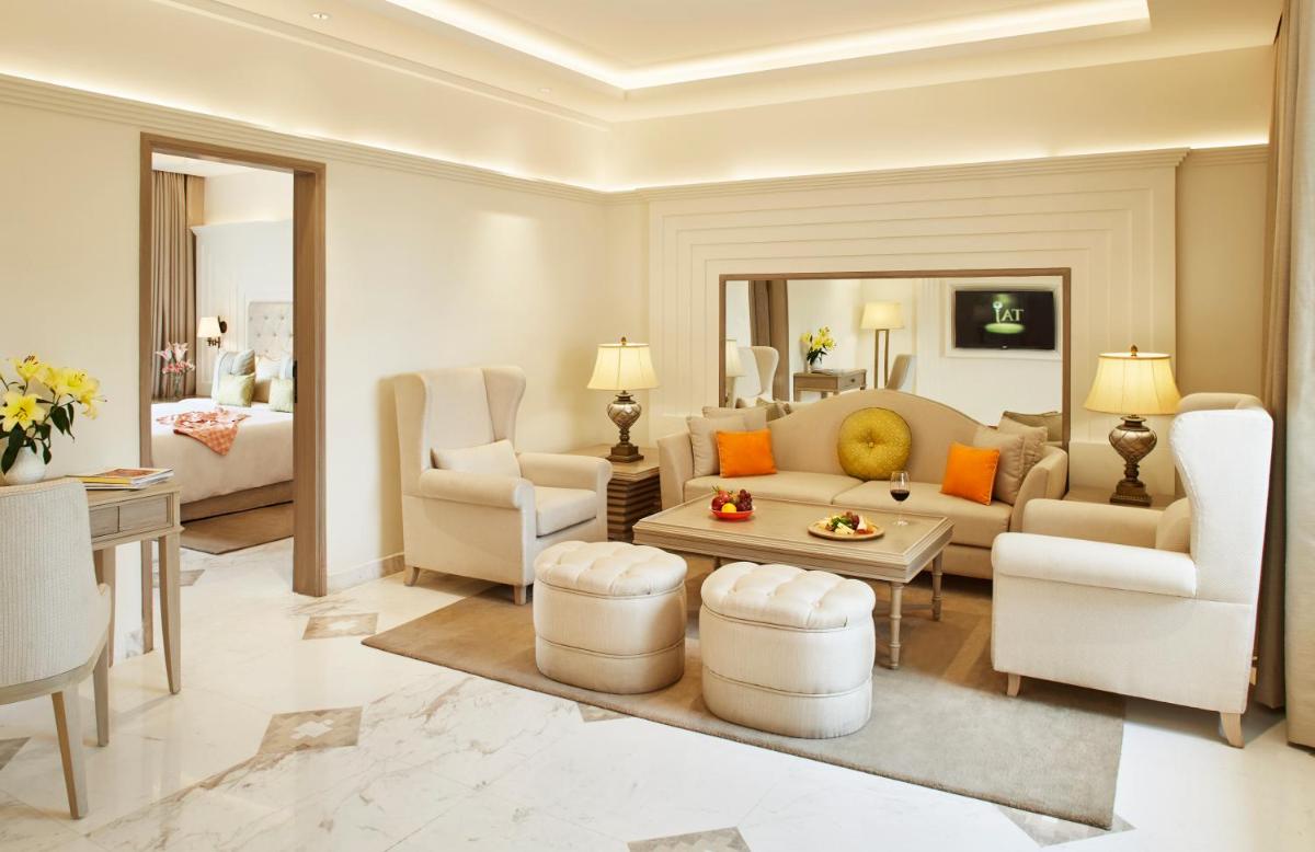 a living room with a couch and a table at Taj Ganges Varanasi in Varanasi