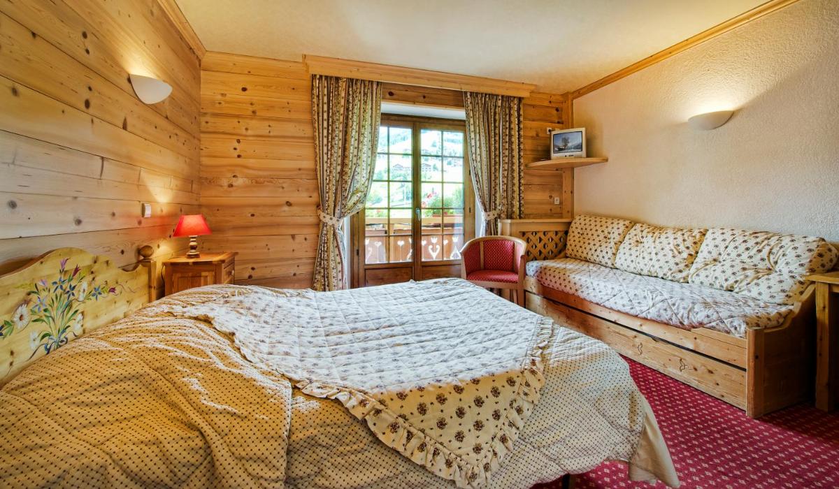 Un ou plusieurs lits dans un hébergement de l'établissement Hotel les Sapins