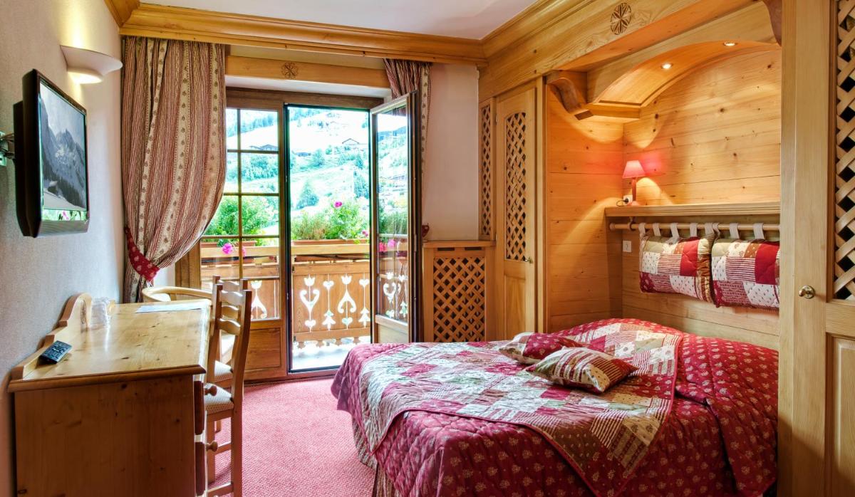 Un ou plusieurs lits dans un hébergement de l'établissement Hotel les Sapins