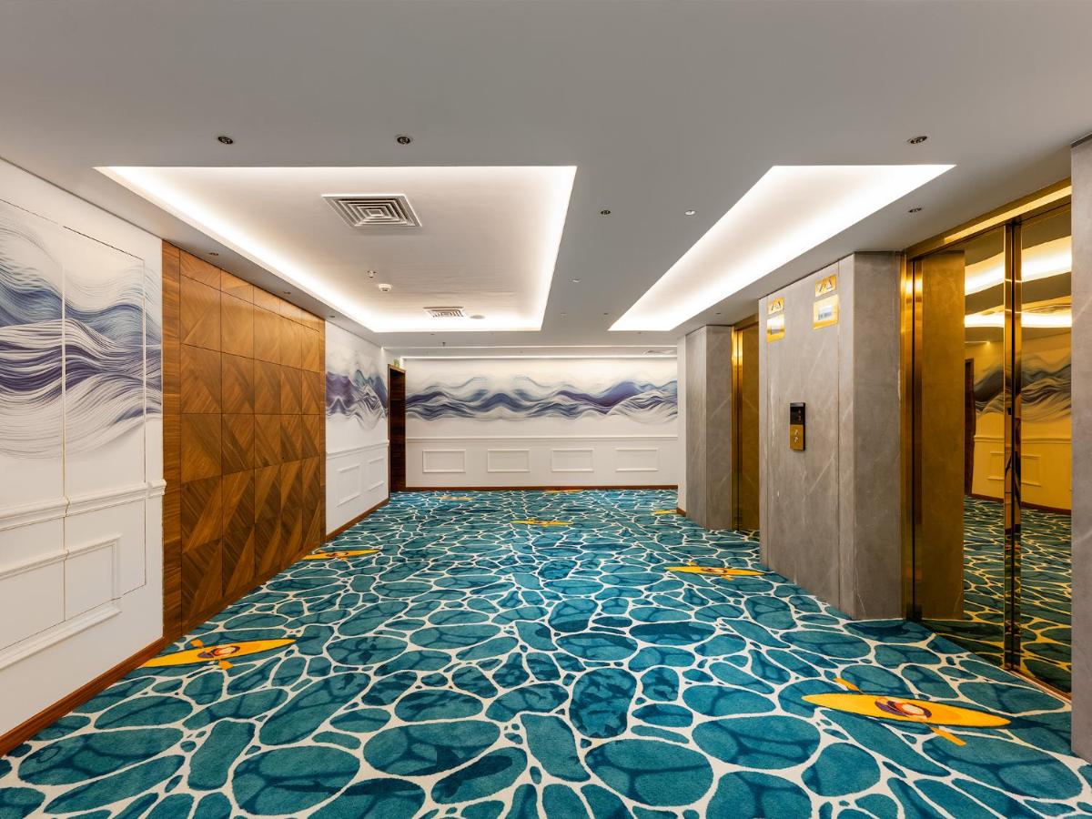 a hallway with a colorful floor in a hotel at Gateway Goa, Palolem in Palolem