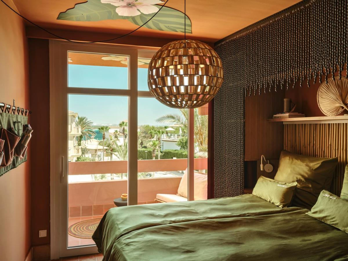 Cama o camas de una habitación en Bikini Island & Mountain Hotel Es Trenc -Adults only-