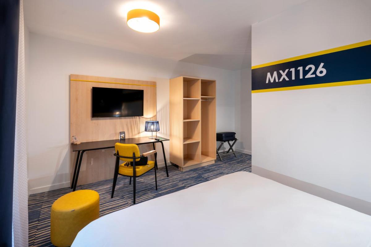 Télévision ou salle de divertissement dans l'établissement ibis Styles Morlaix