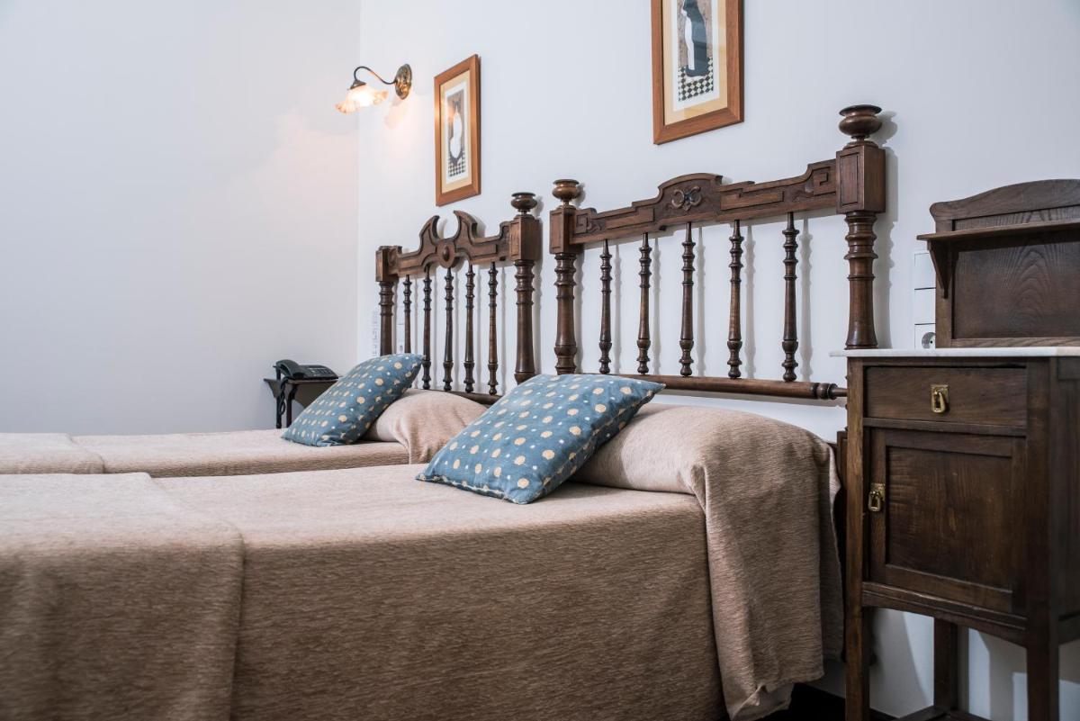 Cama o camas de una habitación en Hotel Monumento Pazo do Castro