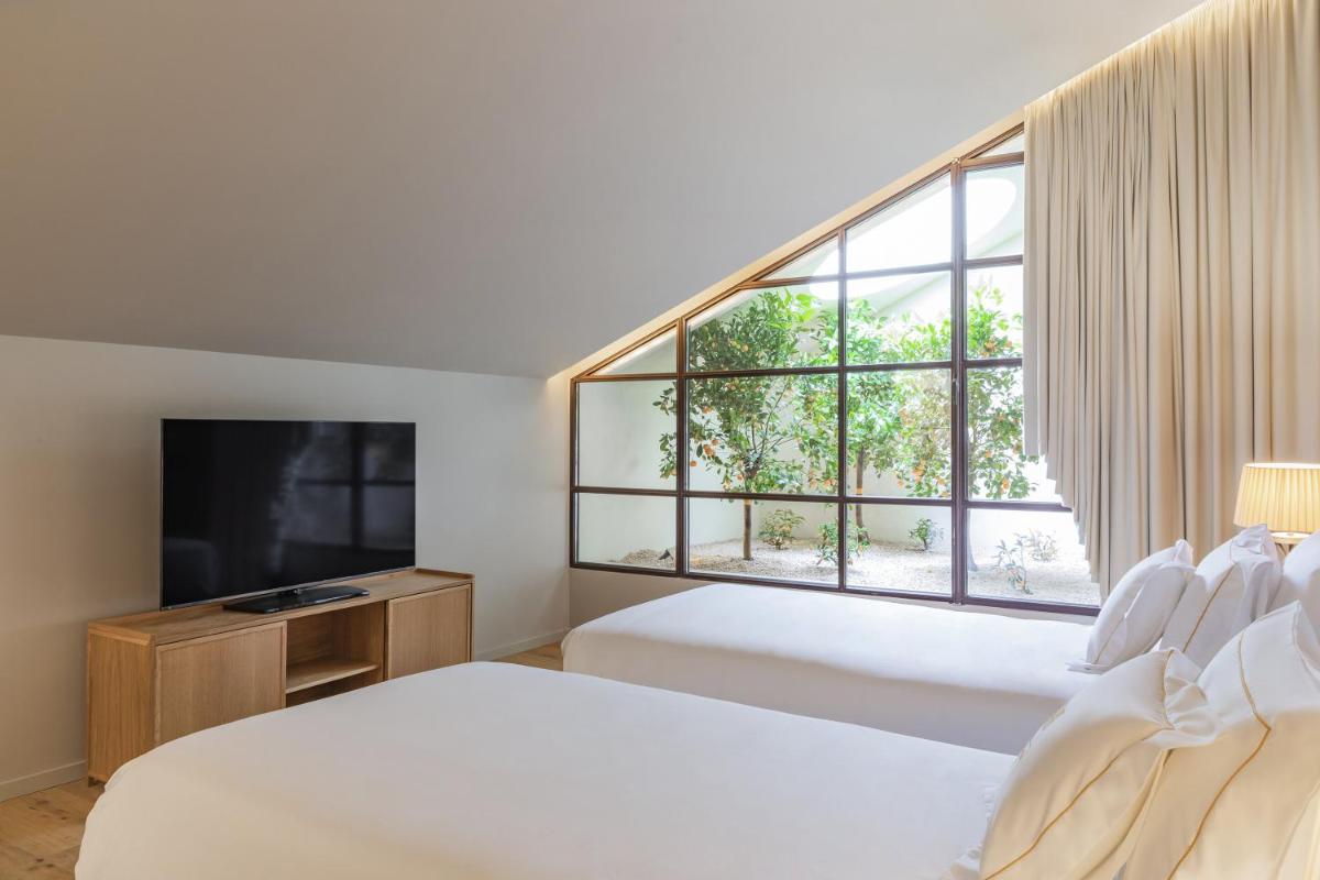 Uma cama ou camas num quarto em Casa da Companhia Hotel & Spa, Vignette Collection by IHG