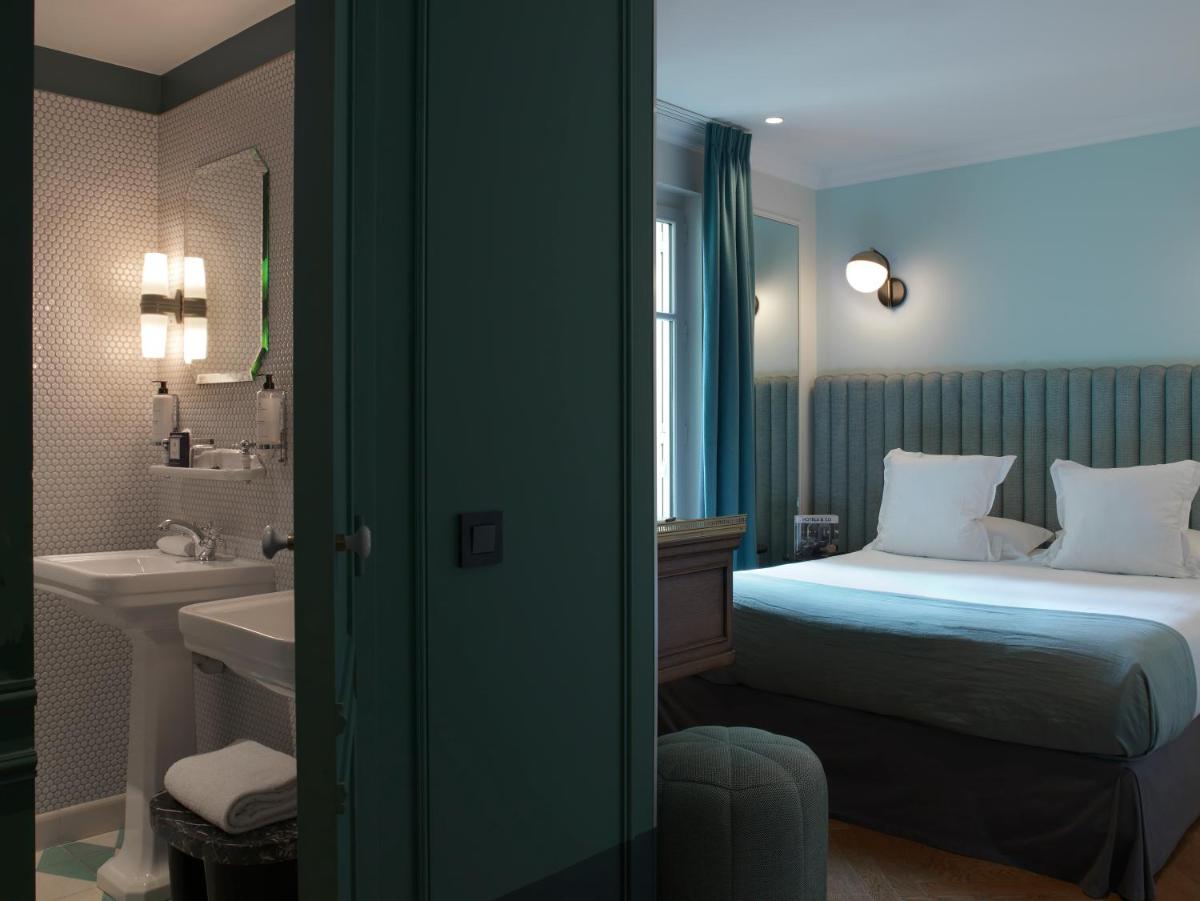 Un ou plusieurs lits dans un hébergement de l'établissement Hotel Bachaumont