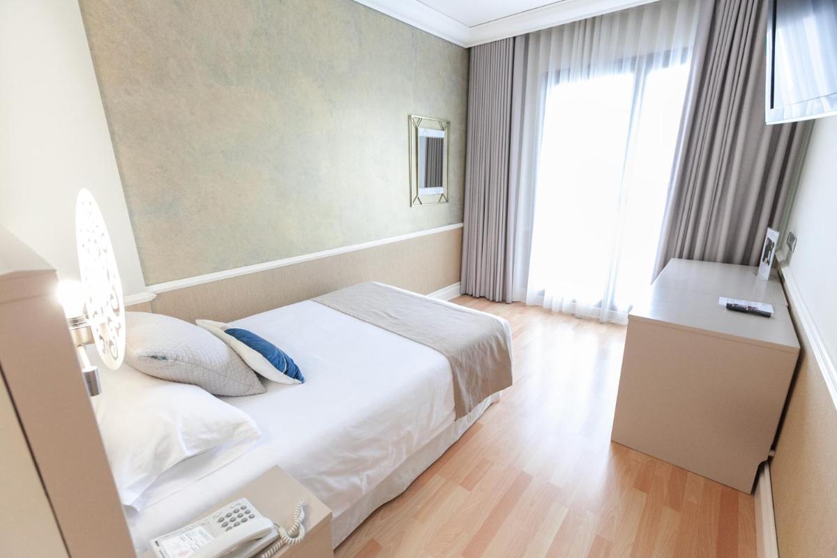 Cama o camas de una habitación en Hotel Alfonso VIII