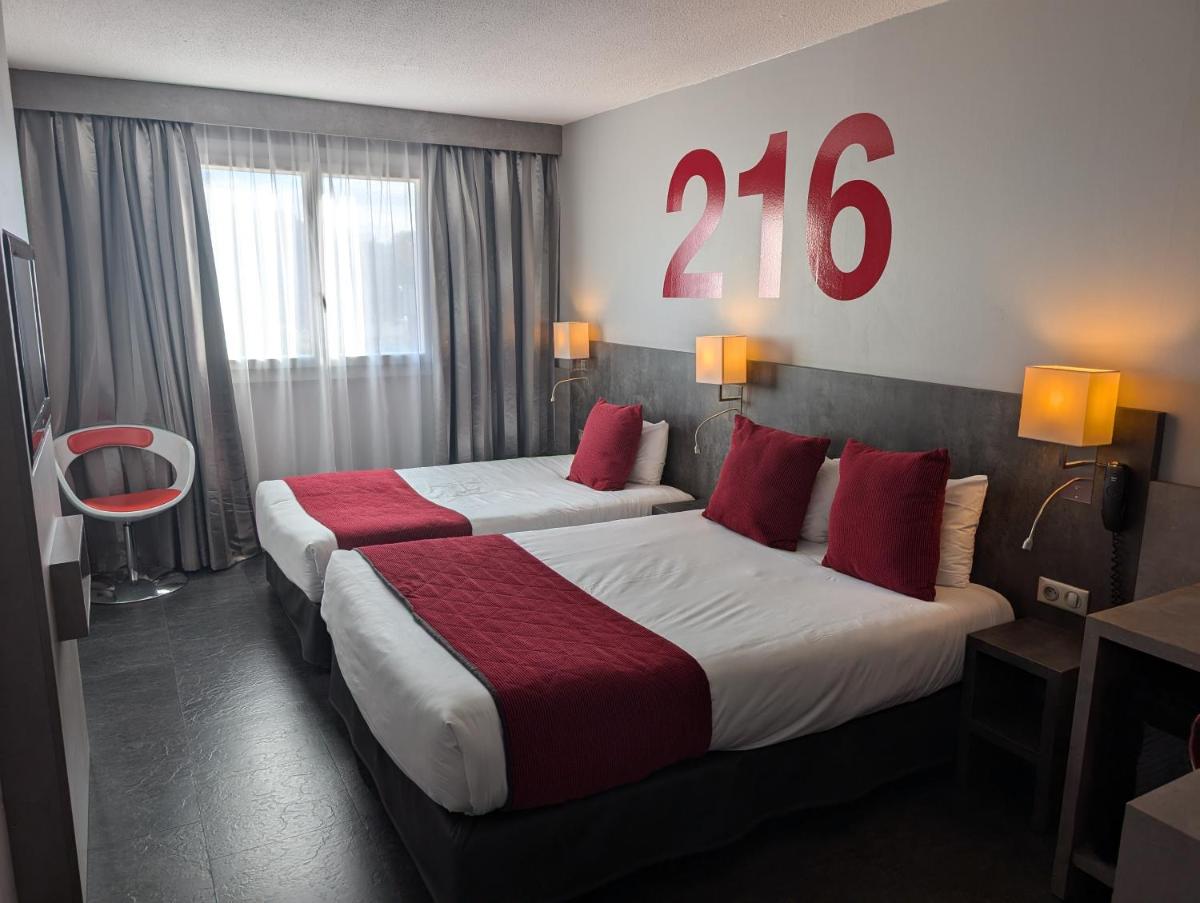 Un ou plusieurs lits dans un hébergement de l'établissement Hotel L'Hotan