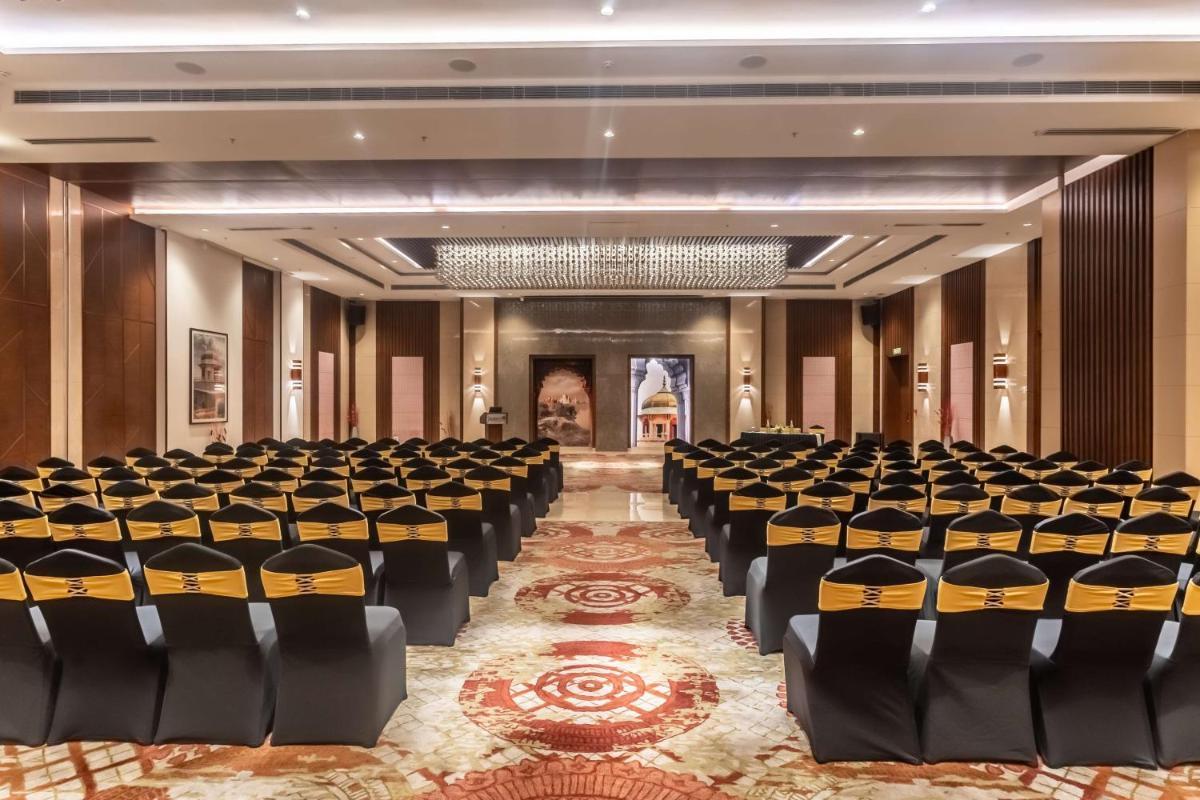 a large room with rows of chairs in it at Radisson Blu Hotel, Greater Noida in Greater Noida