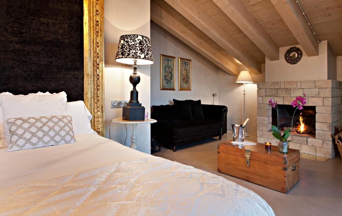 Cama o camas de una habitación en La Vella Farga Hotel