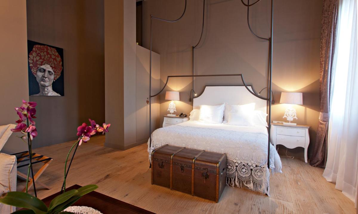 Cama o camas de una habitación en La Vella Farga Hotel