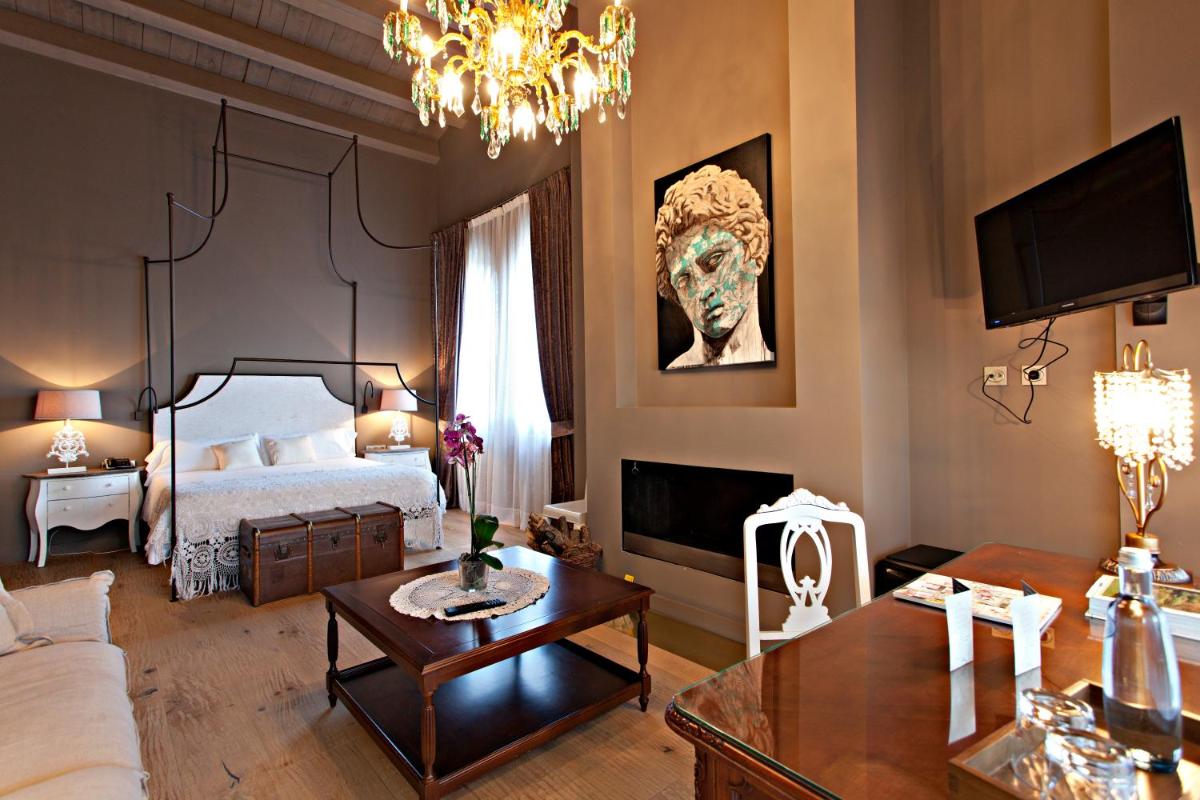 Cama o camas de una habitación en La Vella Farga Hotel