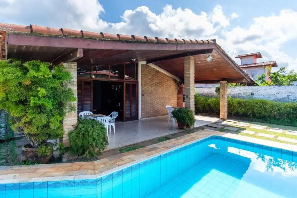 BH4 · BH4: CASA COM PISCINA AO LADO DA PRAIA GRANDE - Housity