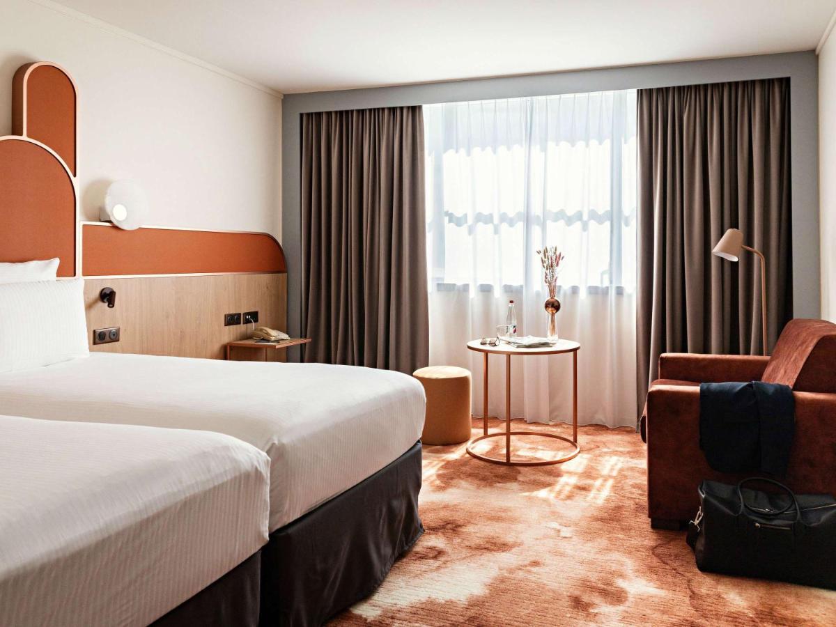 Un ou plusieurs lits dans un hébergement de l'établissement Pullman Paris Centre - Bercy