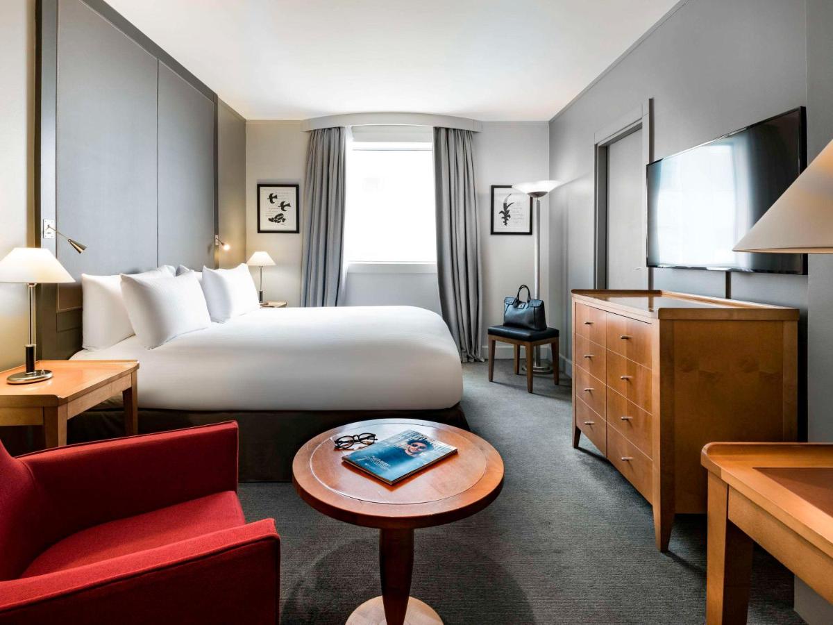 Un ou plusieurs lits dans un hébergement de l'établissement Pullman Paris La Défense