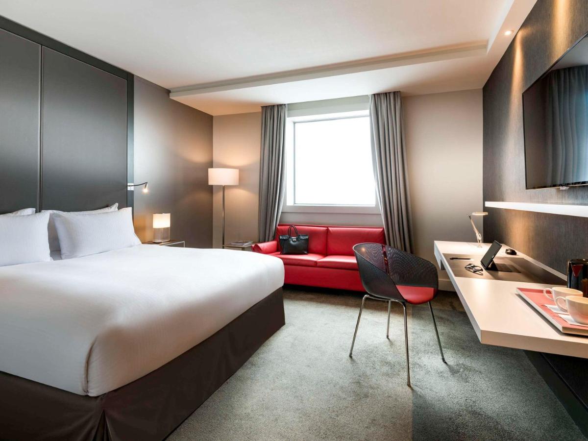 Un ou plusieurs lits dans un hébergement de l'établissement Pullman Paris La Défense