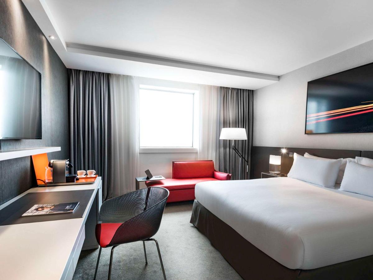 Un ou plusieurs lits dans un hébergement de l'établissement Pullman Paris La Défense