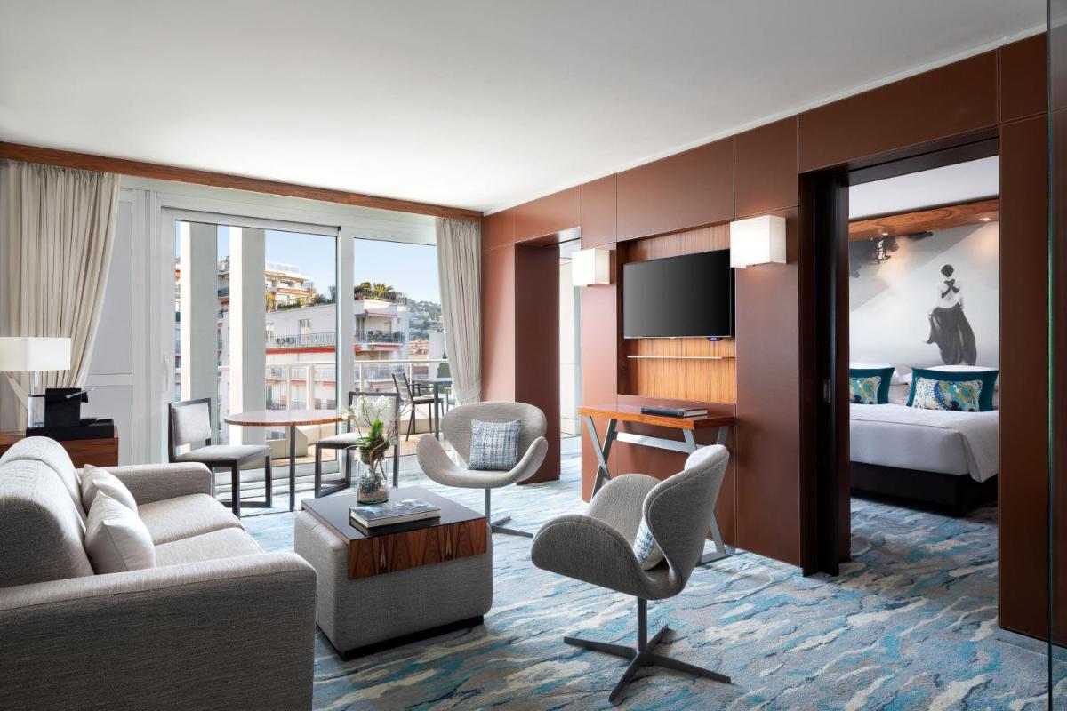 Un ou plusieurs lits dans un hébergement de l'établissement JW Marriott Cannes