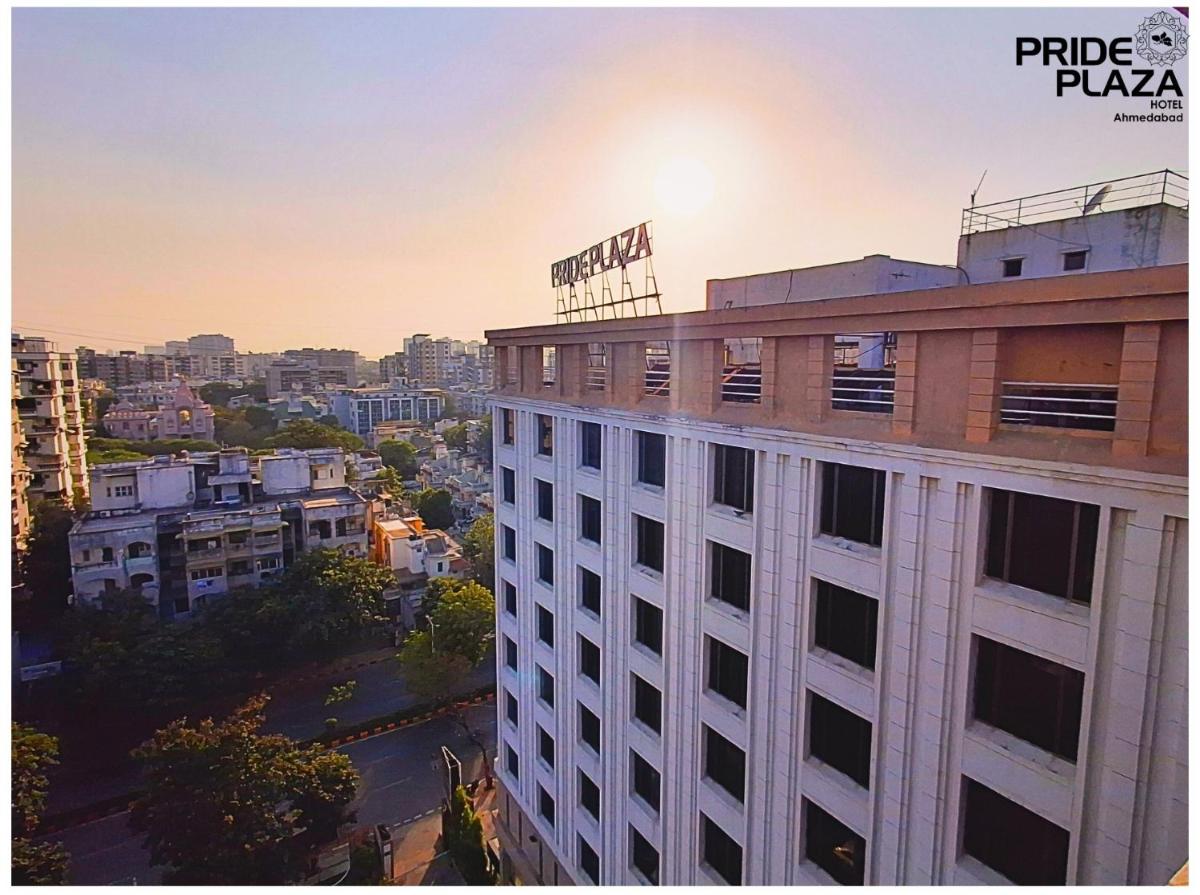 a building with a sign on the top of it at Pride Plaza Hotel, Ahmedabad in Ahmedabad