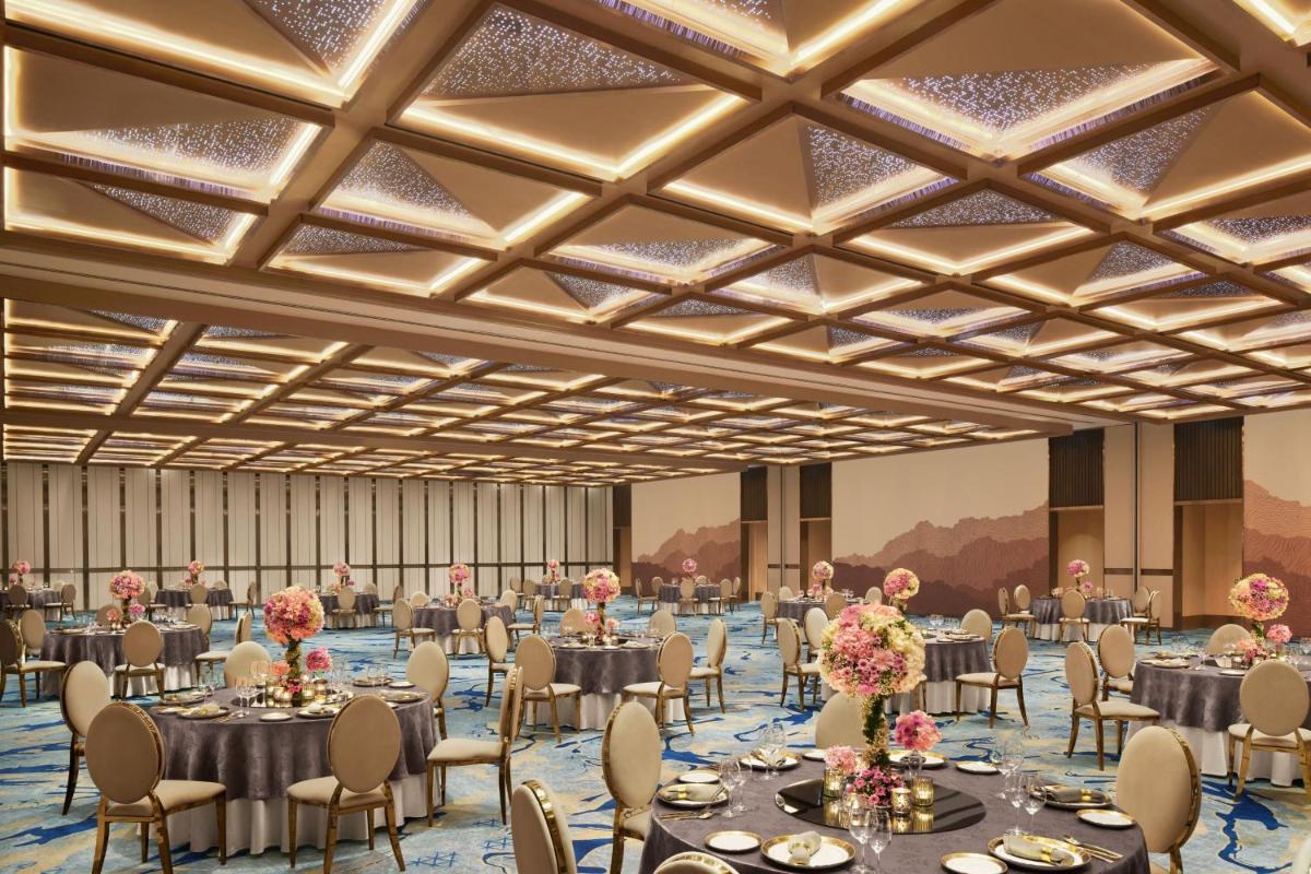 a rendering of a banquet hall with tables and chairs at JW Marriott Mumbai Juhu in Mumbai