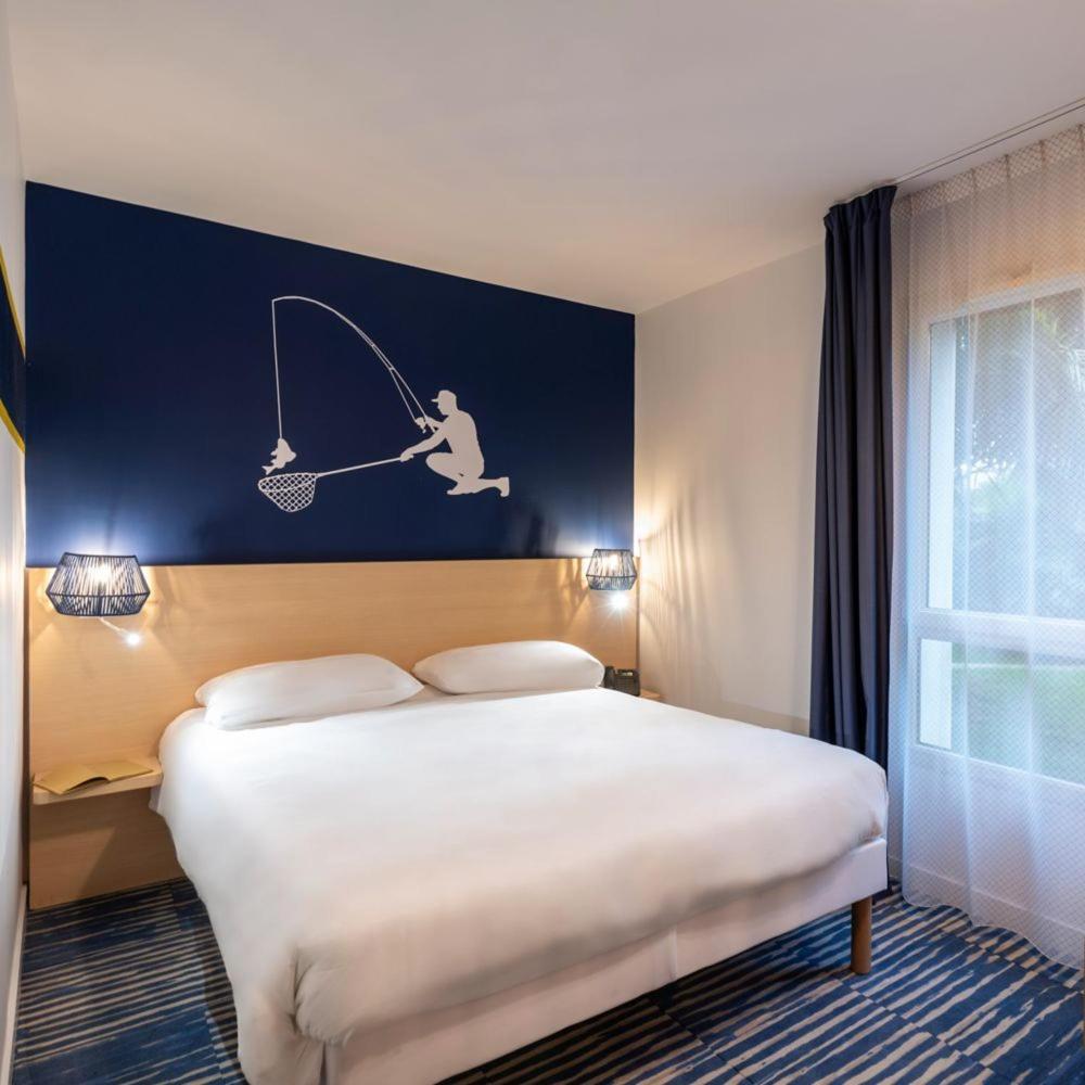 Un ou plusieurs lits dans un hébergement de l'établissement ibis Styles Morlaix