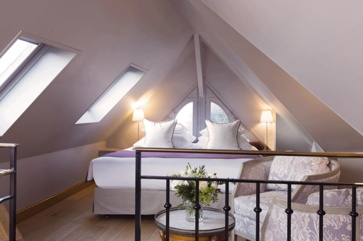 Un ou plusieurs lits dans un hébergement de l'établissement La Ferme Saint Simeon Hotel & Spa - Relais & Chateaux