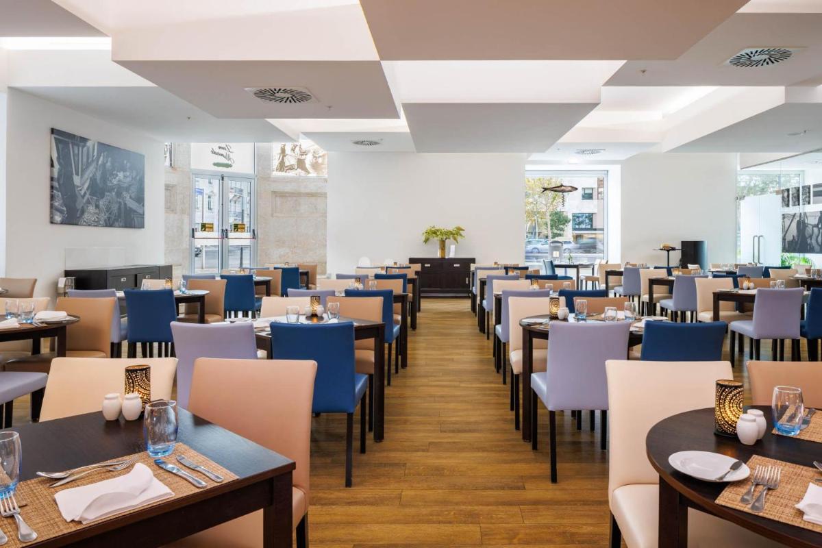 Um restaurante ou outro lugar para comer em Jupiter Lisboa Hotel - Rooftop & Spa