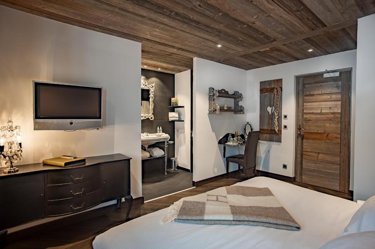 Un ou plusieurs lits dans un hébergement de l'établissement Chalet-Hôtel Hermitage