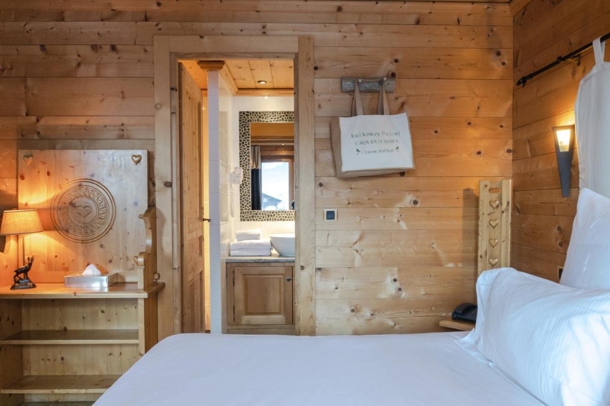 Un ou plusieurs lits dans un hébergement de l'établissement Chalet-Hôtel Hermitage