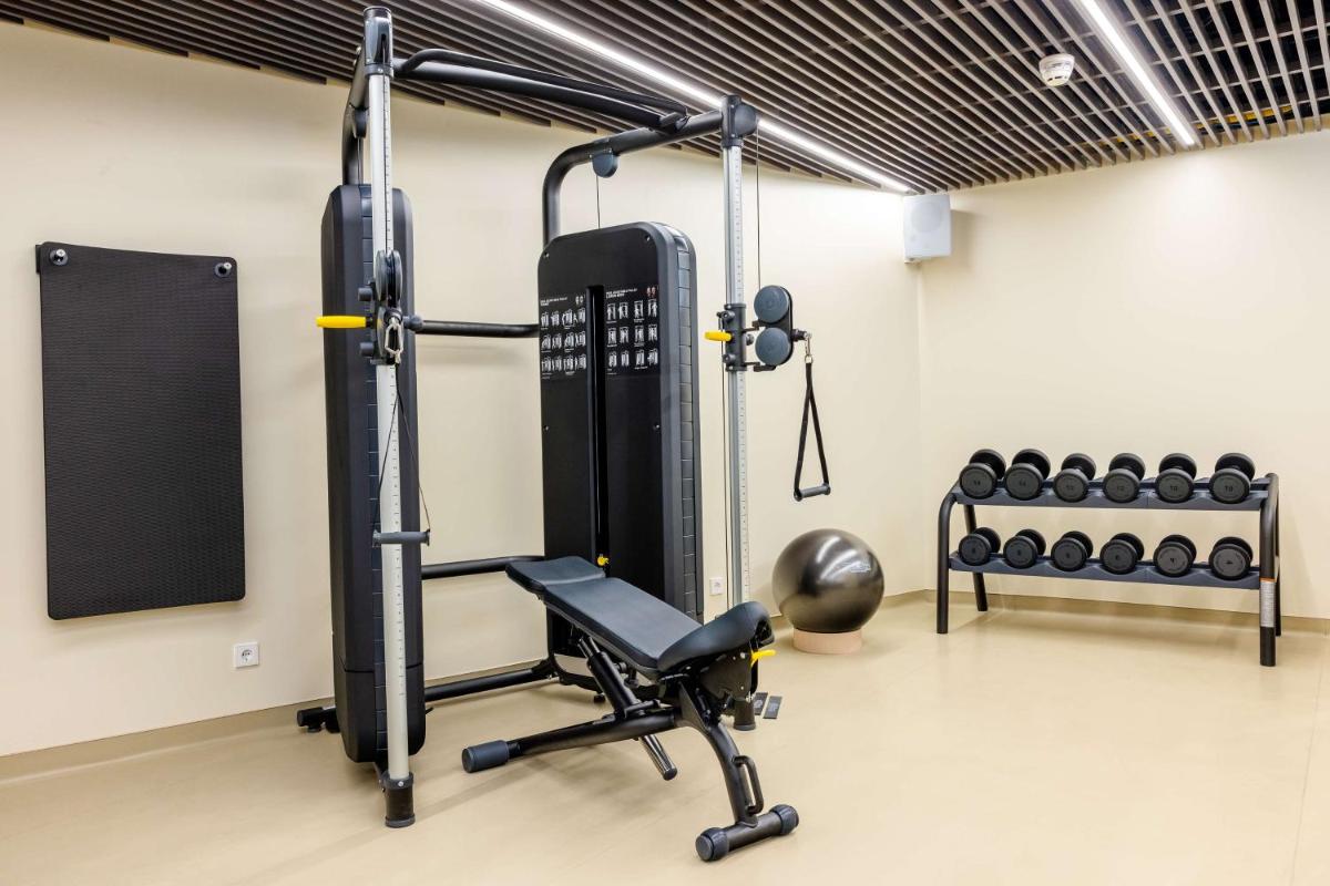 O centro de fitness e/ou as comodidades de fitness de Cenica Porto Hotel, Curio Collection By Hilton