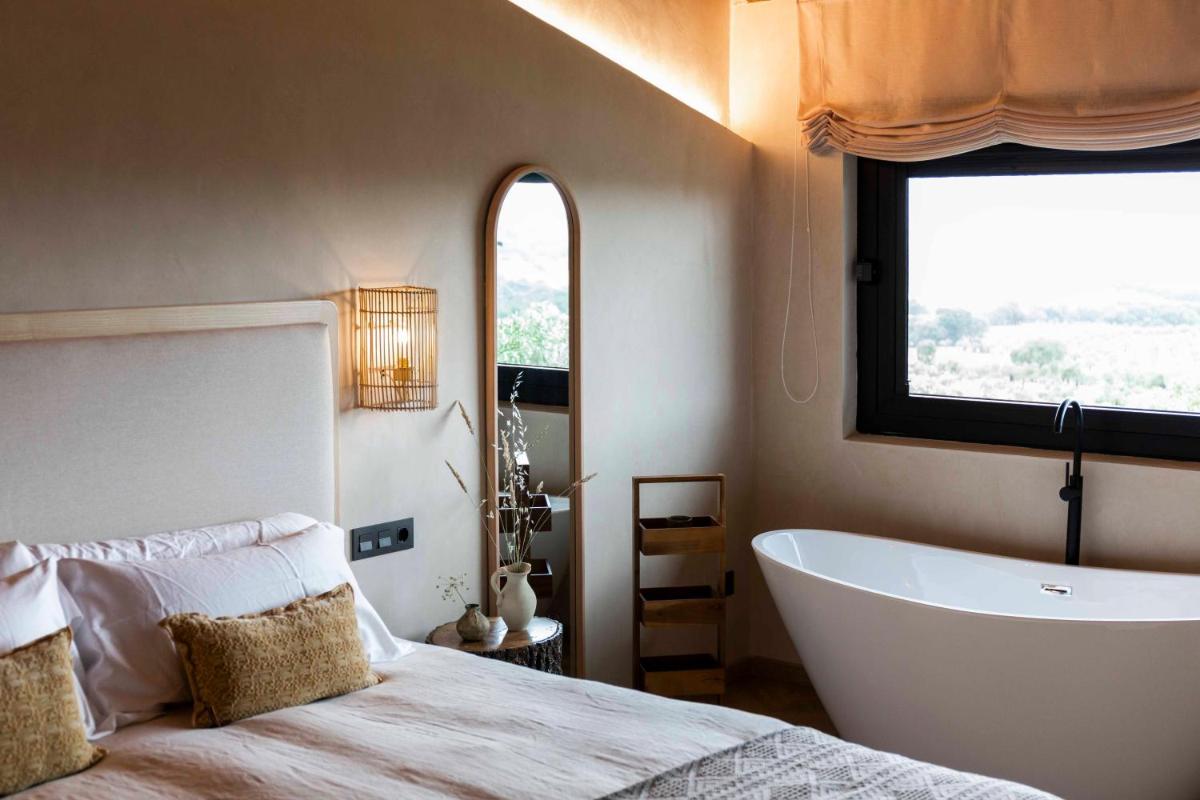 Cama o camas de una habitación en Hábitat Cigüeña Negra