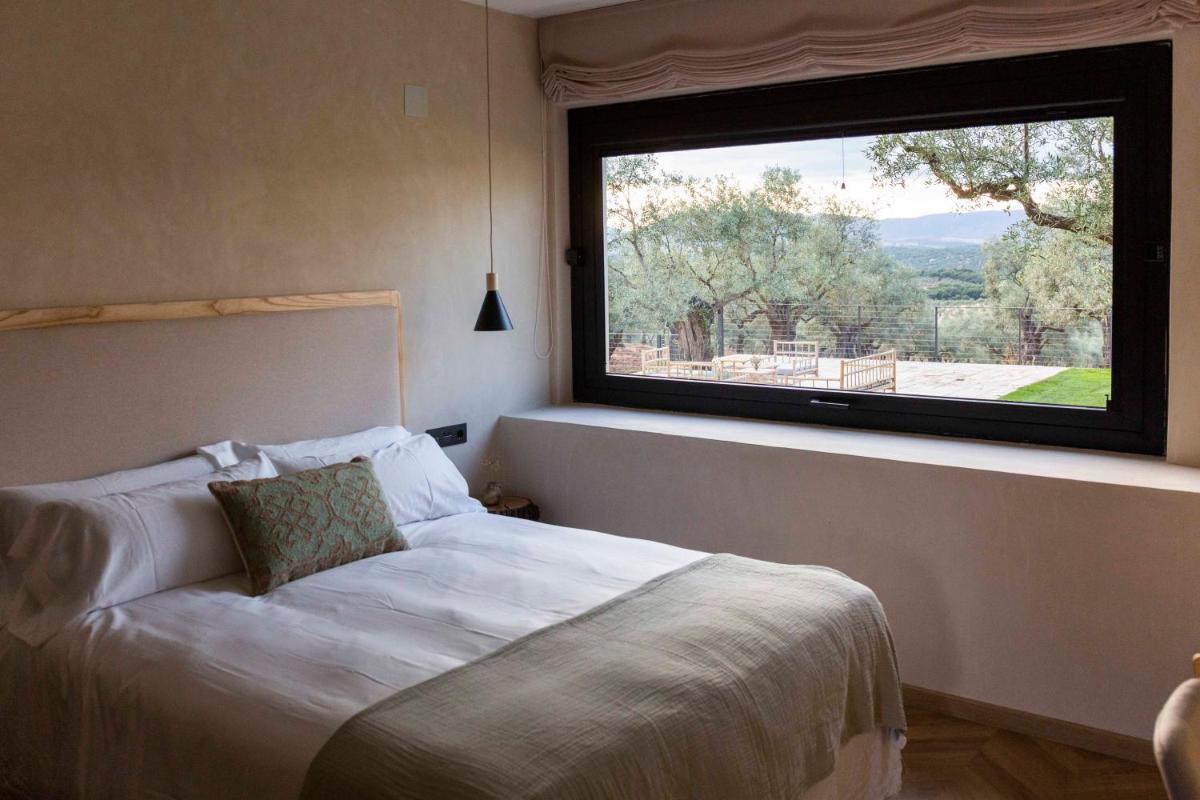 Cama o camas de una habitación en Hábitat Cigüeña Negra