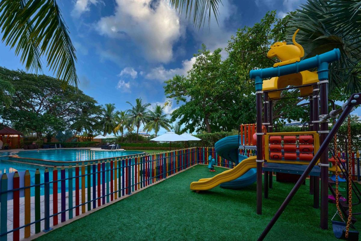 a water park with a slide and a pool at Crowne Plaza Kochi by IHG in Cochin