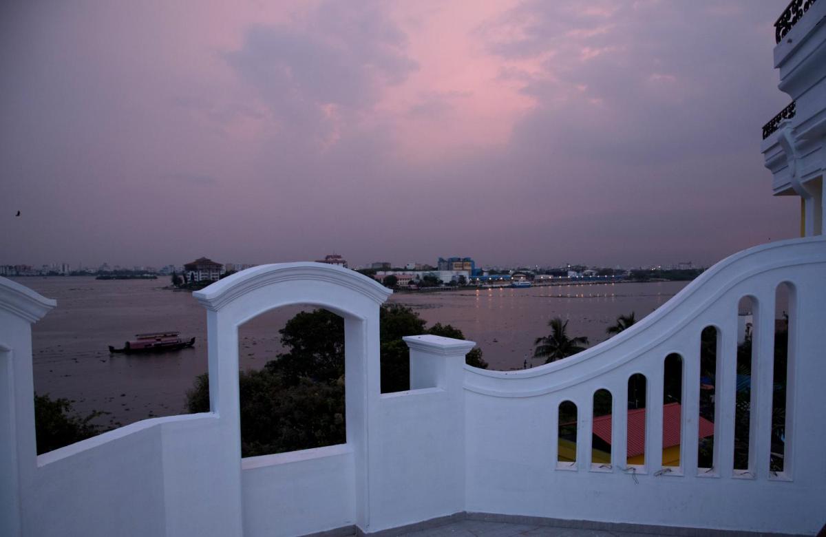 a view of the river from the balcony of a house at Fragrant Nature Kochi - A Five star Classified Hotel in Cochin