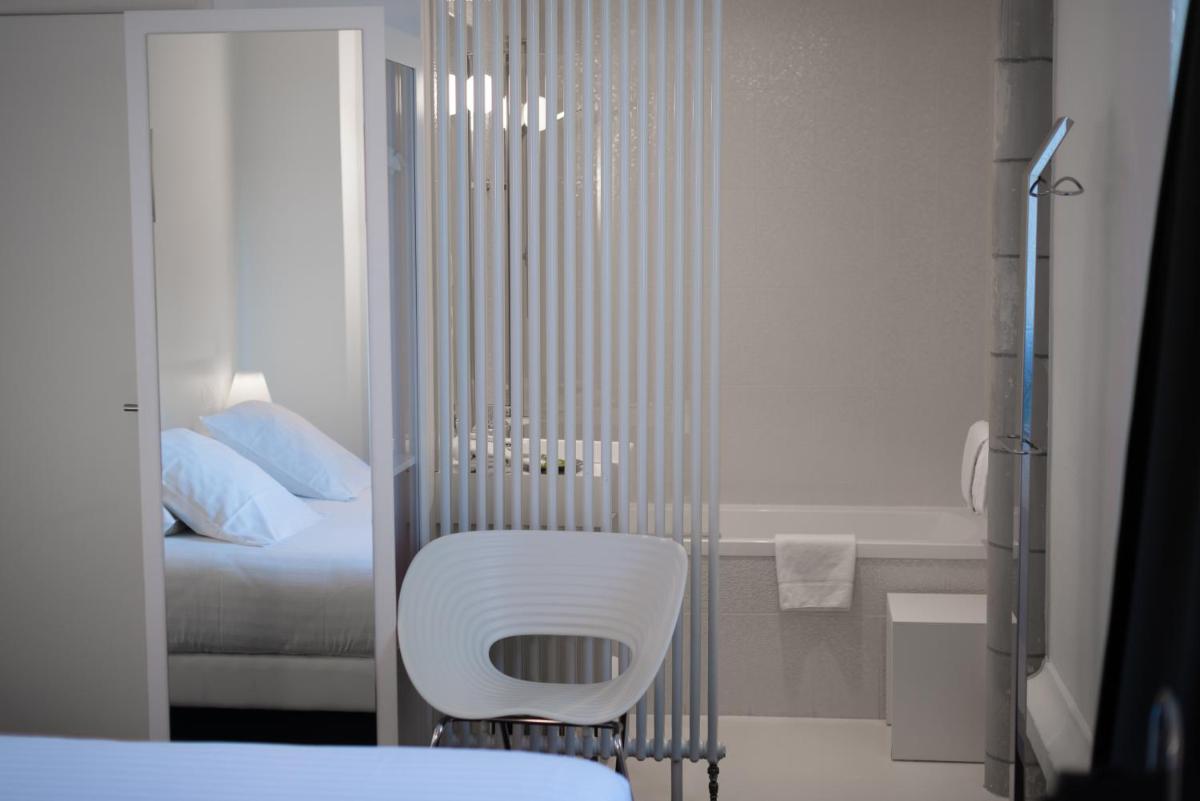 Un ou plusieurs lits dans un hébergement de l'établissement SOZO Hotel