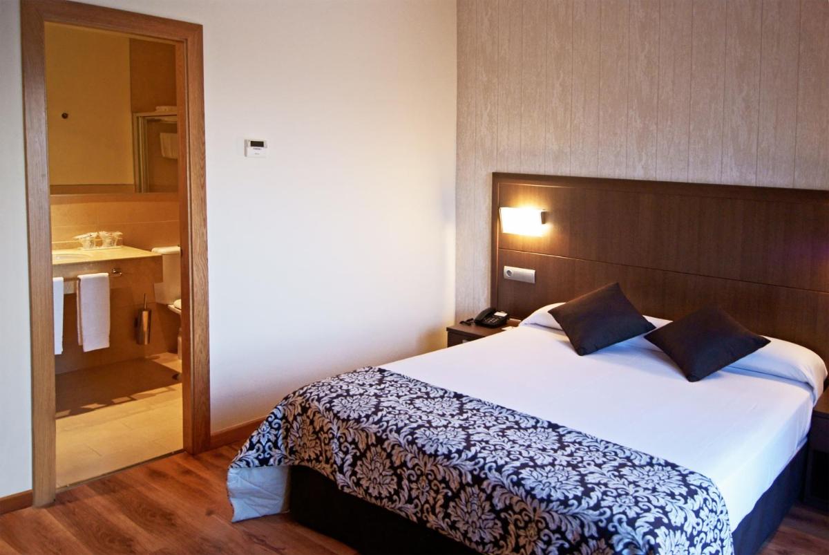 Cama o camas de una habitación en Hotel Andalussia