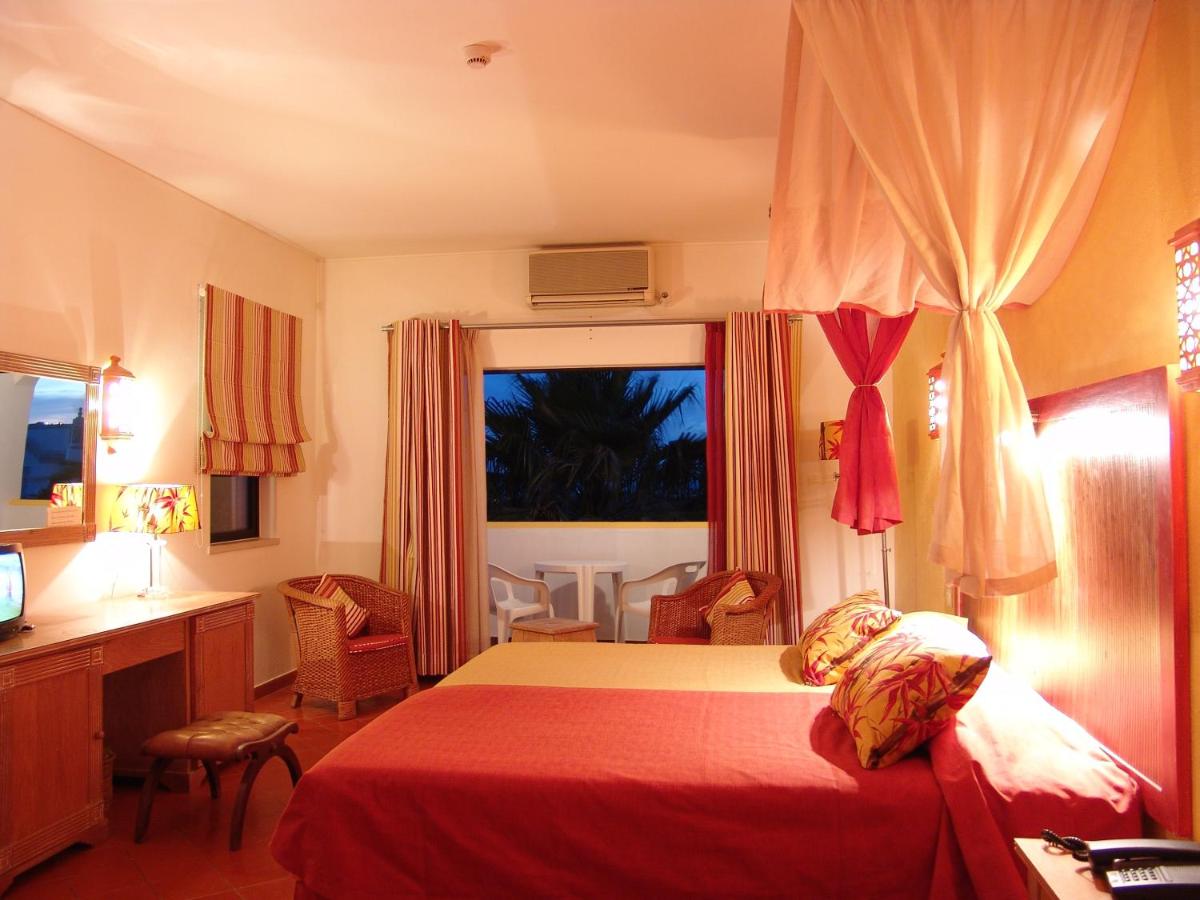 Uma cama ou camas num quarto em Cerro Da Marina Hotel - Adults Only