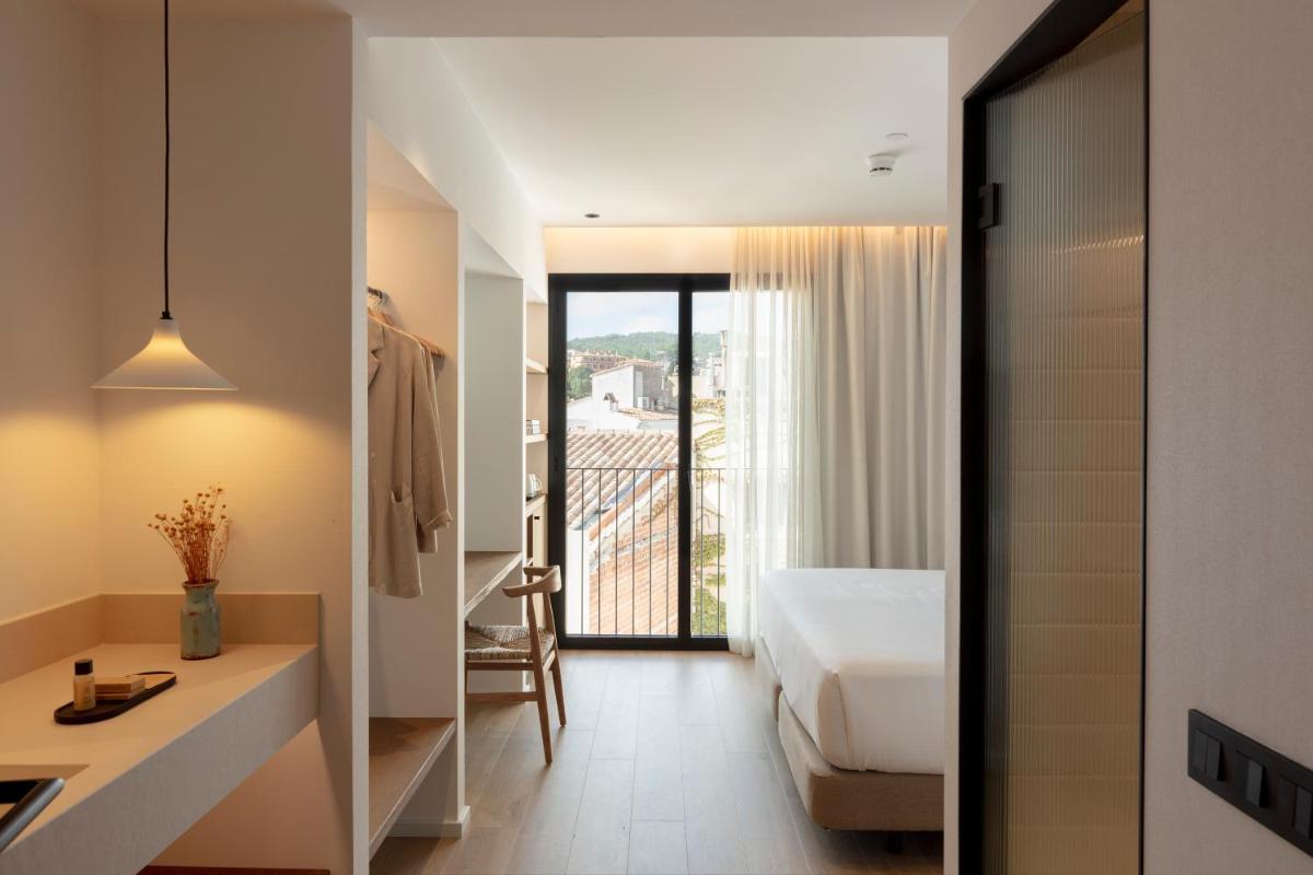Cama o camas de una habitación en Elisabeth by the Sea Hotel