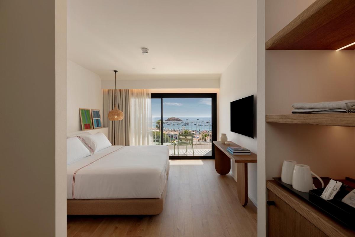 Cama o camas de una habitación en Elisabeth by the Sea Hotel