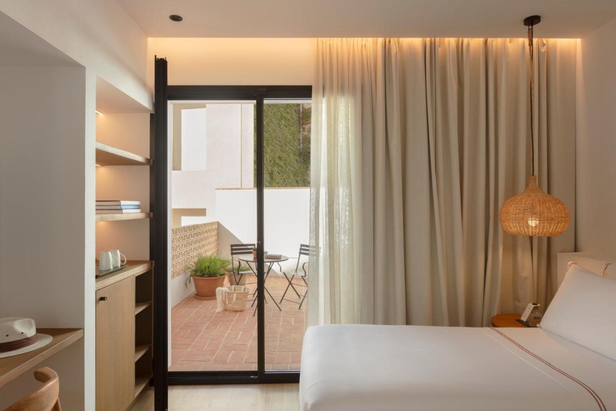 Cama o camas de una habitación en Elisabeth by the Sea Hotel