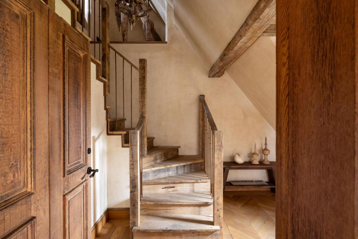 Un ou plusieurs lits dans un hébergement de l'établissement La Ferme Saint Simeon Hotel & Spa - Relais & Chateaux